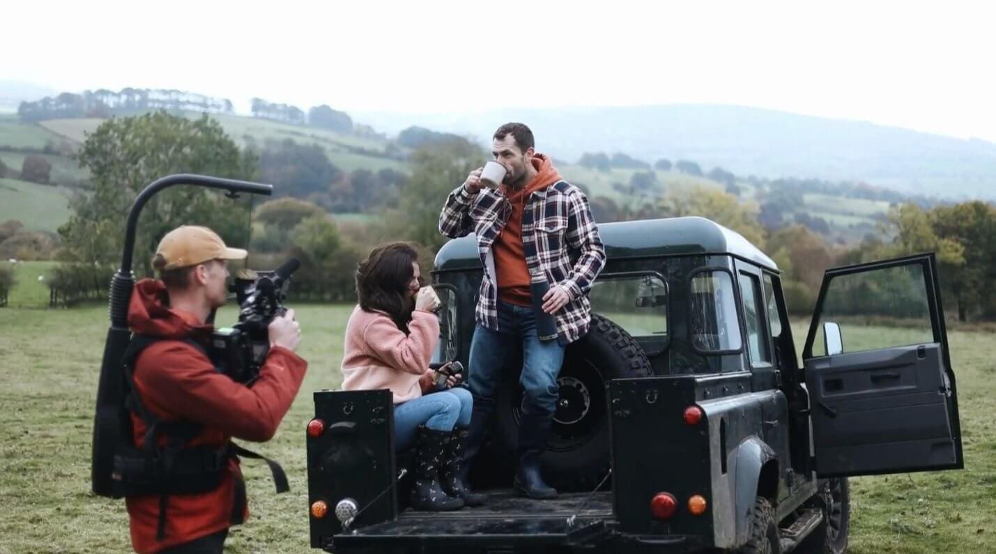 An image of a film crew on a here now films set.