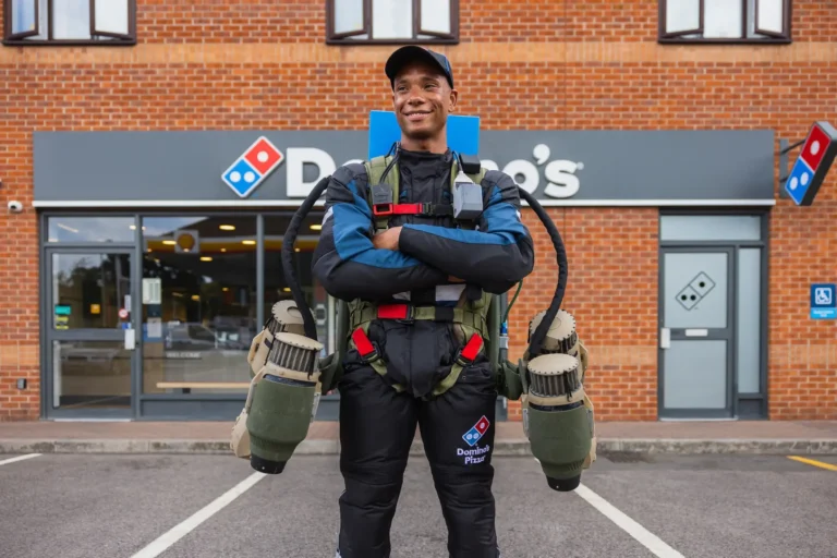 An image of a Dominos Delivery man with a jetpack on his back.