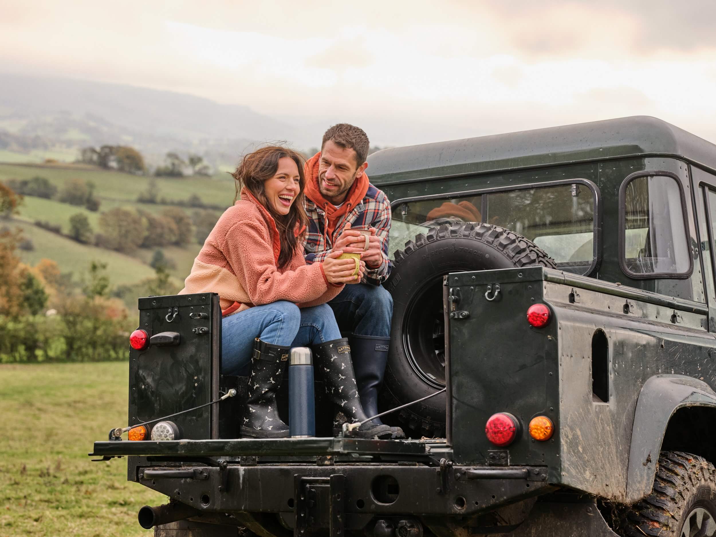 Manchester 30 Kelvin and Liz Fletcher in a Land Rover on their farm for FatFace