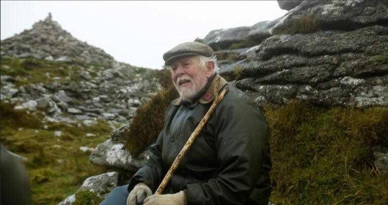 An image of Robin Hanbury-Tenison resting after successfully climbing Brown Willy for BBC World.