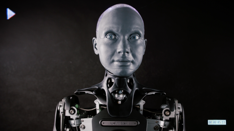 A profile shot of AMECA the robot looking into the barrel of the lens