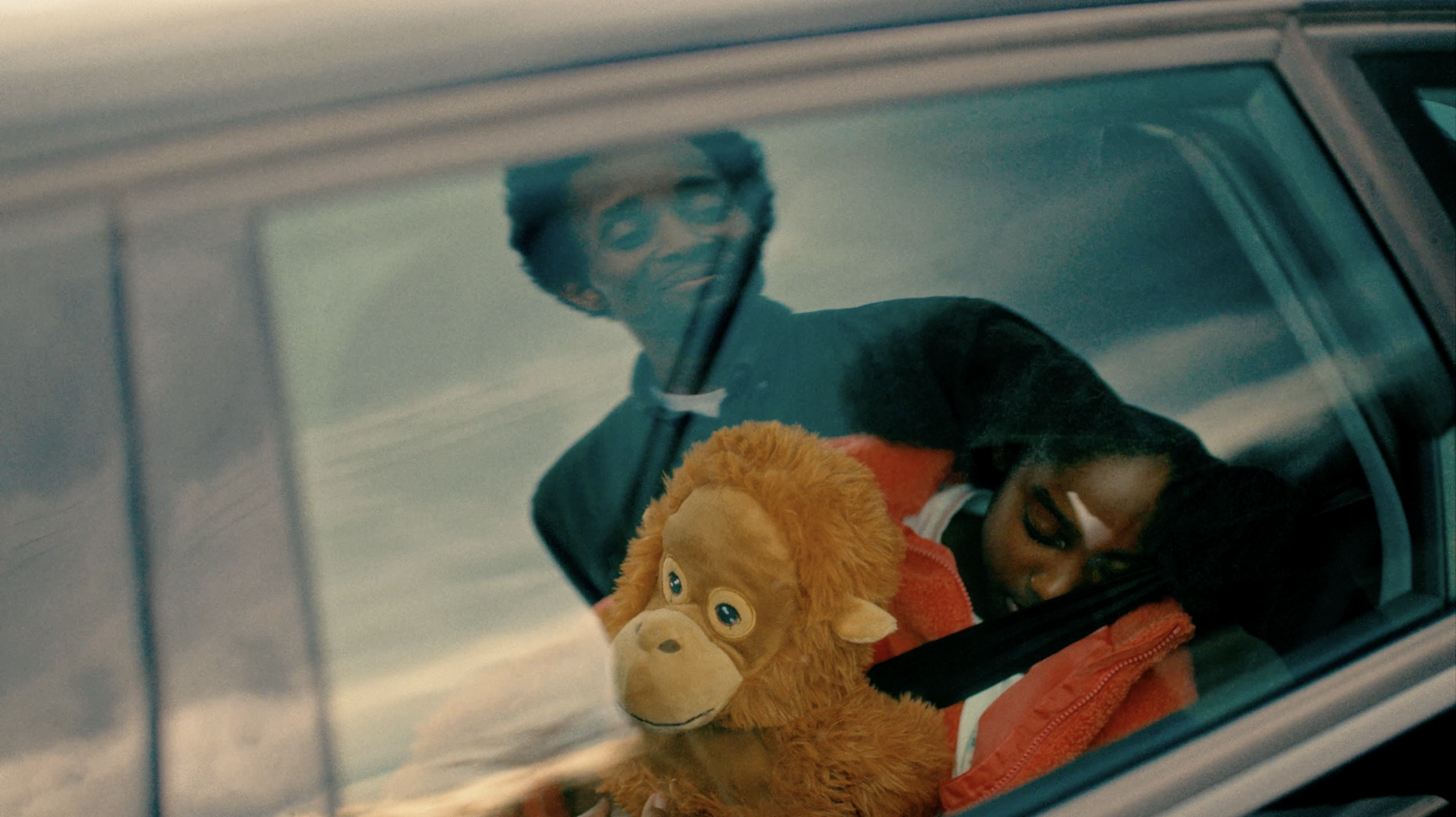 An image of a child asleep in the back of a car taken from our recent commercial video production in London.