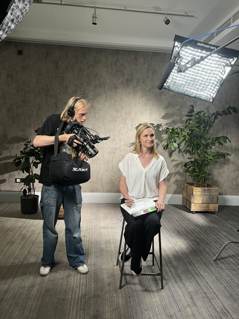 An image of Olaf Laurence, a Camera Assistant, filming during the Aimhi x Pepsi co testimonial video shot in county hall London.