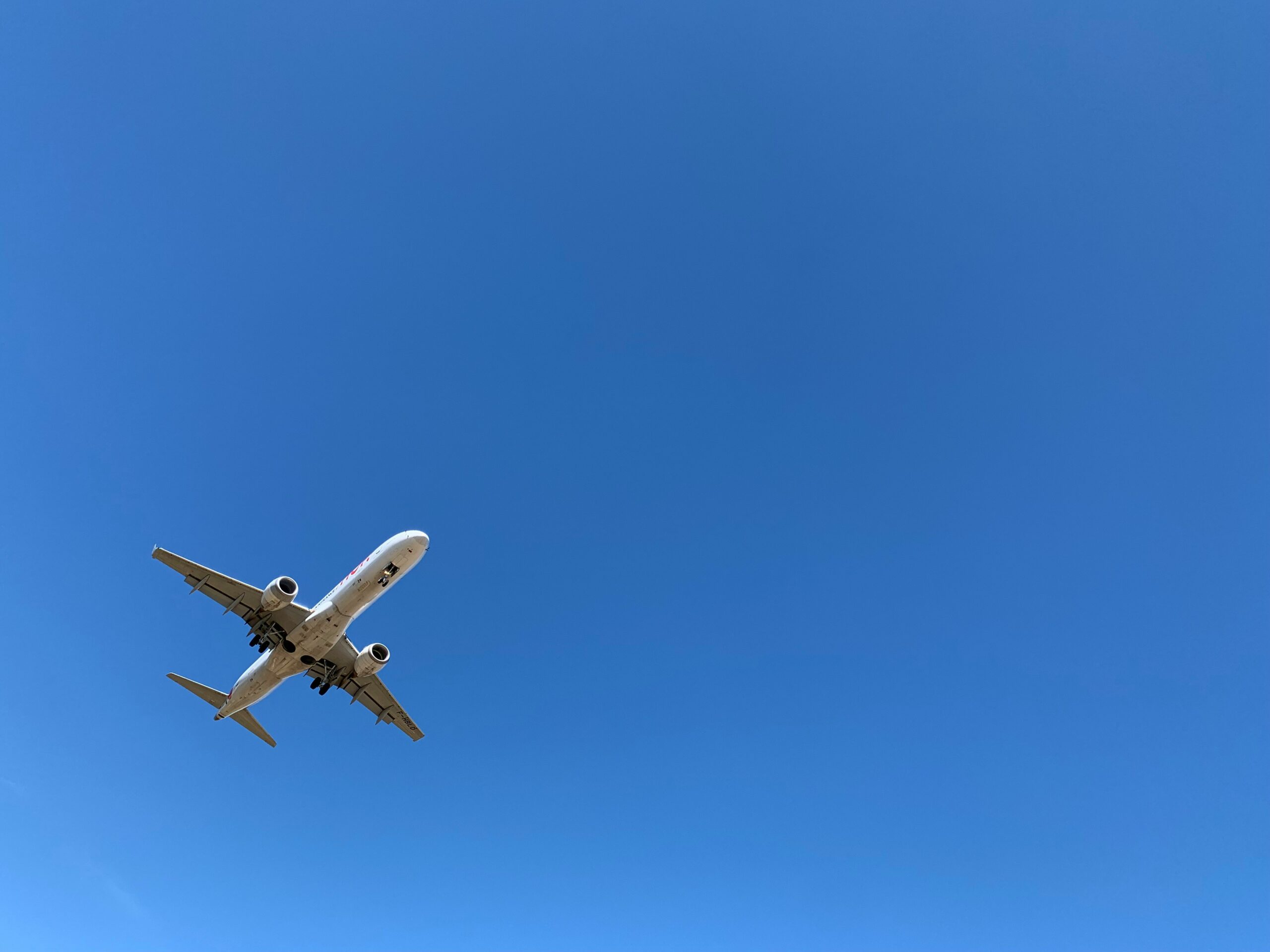 A picture of a plane flying through the sky for the Film Equipment Import Page.