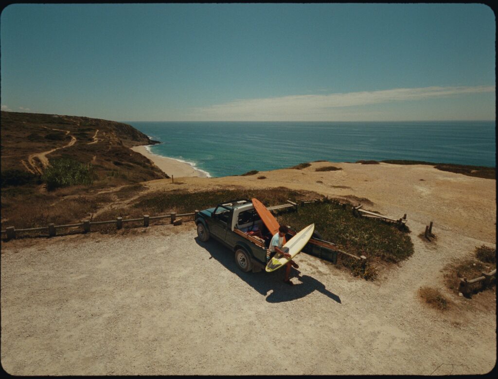 A camper van on a clifftop above the Atlantic in Ericeira, Portugal