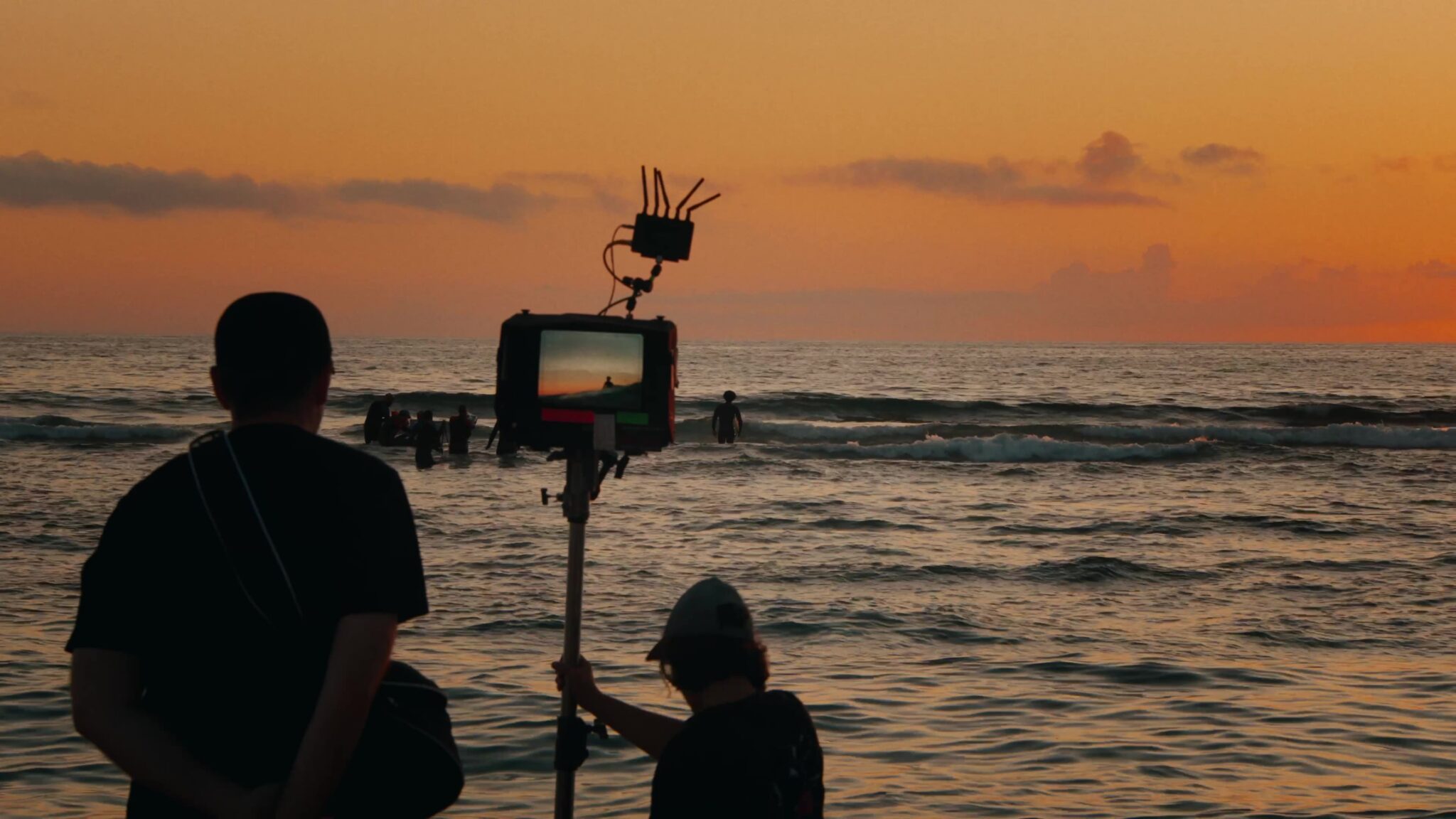 The Here Now Films crew filming from the Atlantic at sunset in Ericeira