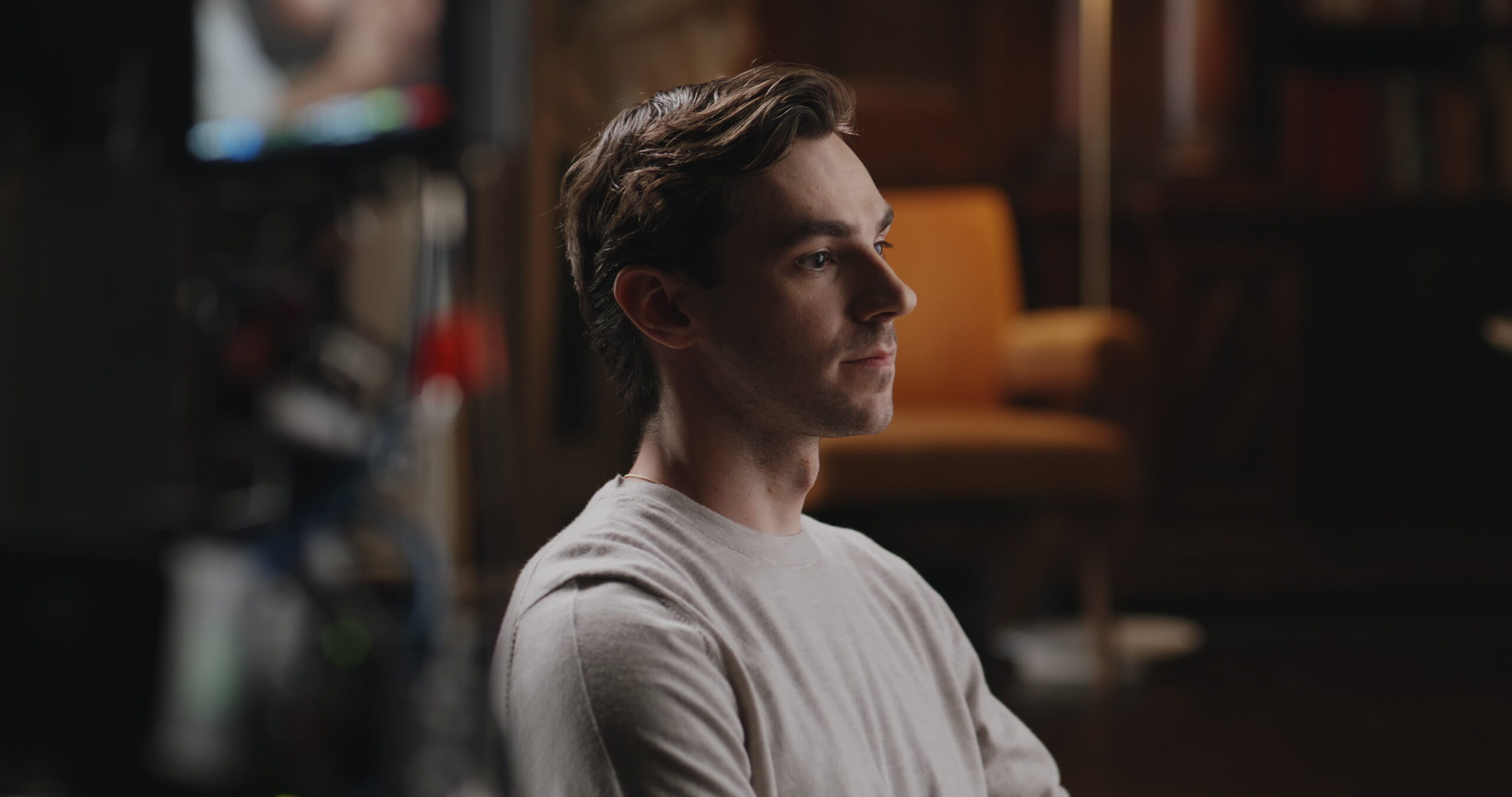 Mark Swan, chief executive of Nevis, in profile in the library set, from the Nevis × Focus announcement film